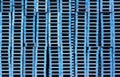 Many pallets stacked blue background for shipping industry