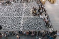 Many panda sculptures place on the floor is an art exhibition with audiences and visitors take photos in Bangkok, Thailand