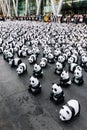 Many panda sculptures place on the floor is an art exhibition with audiences and visitors take photos in Bangkok, Thailand