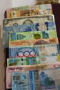 A lot of paper bills of various countries located on the numismatic album Royalty Free Stock Photo