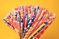 Many paper drinking straws on orange background, closeup Royalty Free Stock Photo