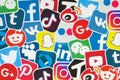 Many paper icons with logo of most popular social networks and smartphone apps for chat and conversations online