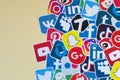 Many paper icons with logo of most popular social networks and smartphone apps for chat and conversations online
