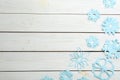 Many paper snowflakes on white wooden background, flat lay. Space for text Royalty Free Stock Photo