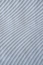 Many parallel embossed white curves on slab close