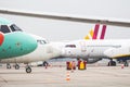 Many parked airplanes at airport