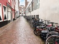 Many parked bicycles near building on city street Royalty Free Stock Photo