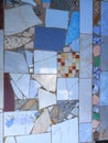 Many parts of broken, cracked, glazed and vintage colored ceramic tiles