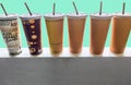 Many pattern a tall glass of paper for a cool drink on a green background Royalty Free Stock Photo