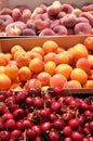 Many peaches, apricots and cherries on a market