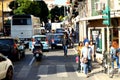 Many pedestrians, tourists, cars on a narrow street in the historic center of Palermo, 8 October 2018, Sicily, Italy