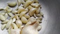 Many peeled cloves of garlic in bowl Royalty Free Stock Photo