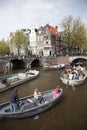 Many people on canal trip in centre of dutch capital amsterdam Royalty Free Stock Photo