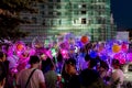 LED balloons people, holding many lighted balloons filled with toys and lights