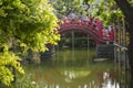 Tokyo, Japan May 3,2019: many people are crossing red bridge in a japanese garden Royalty Free Stock Photo