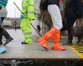many people on the footbridge with plastic gaiters in Venice in
