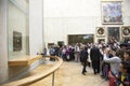 Many people in front of mona lisa in louvre museum Royalty Free Stock Photo