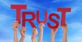 Many People Hands Holding Red Word Trust Blue Sky