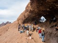 Many people hiking in the famous Hole in the Rock