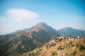 Many people hiking on the path to the famos location, Sunset Peak, Lantau Island, Hong Kong Royalty Free Stock Photo