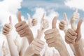 Many people holding their thumbs up Royalty Free Stock Photo