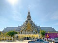 Many people pray respect Golden Buddha statue inside