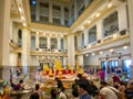 Many people pray respect Golden Buddha statue inside