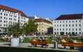 Many people relax on the grass at the Marienhof in the inner city of Munich, Germany