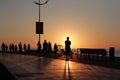 Many people silhouettes on sea beach sunset background Royalty Free Stock Photo