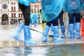 Many people with special gaiters during the record flood in Veni