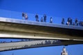 Many people stand on a glass bridge in Zaryadye park in Moscow. Popular landmark.