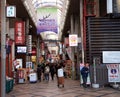 Many people in the street shopping on the morning at Nara`s downtown market street.