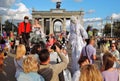 Many people take pictures of street actors in Moscow