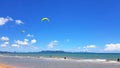 Many people or tourist playing kite surfing on sea with clear blue sky and cloud background and copy space at tropical beach Royalty Free Stock Photo