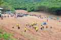 Many people in the tree planting forest background