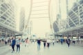 Many people walking on the skywalk with blurry image