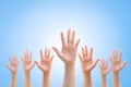 Many people women hands raising up on world map background showing vote, volunteer participation, rights equality concept