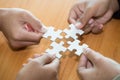 Many persons holding pieces of jigsaw puzzle,Teamwork concept,,Business connection,Success and strategy concept,Business accountin