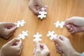 Many persons holding pieces of jigsaw puzzle,Teamwork concept,,Business connection,Success and strategy concept,Business accountin Royalty Free Stock Photo