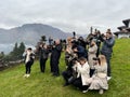 Como, Italy - 12 november 2023: Many photographers stand on the mountain and shoot with cameras