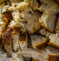 Many pieces of bread in macro closeup, bird food, baking industry background