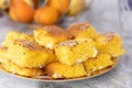 Many pieces of Cornbread served on a plate on the gray marble kitchen table surface