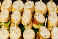 Many pieces of mini sanwich on white dish for buffet lunch. sanwich canape for cocktail dinner. Royalty Free Stock Photo
