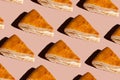many pieces of pie with fish on a pink background
