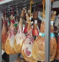 Brussel, Belgium, 20-6-2017: the many pig legs hanging down at a small stand selling meat