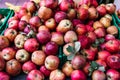 Many piles of apple in the boxes located in the market, the fresh apples