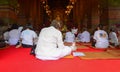 Many pilgrims praying at Buddhist temple in Bangkok, Thailand