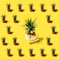 Many pineapples on a solid yellow background pattern