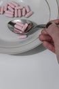 Pink pills in the plate Royalty Free Stock Photo