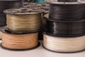 Many PLA and ABS filament spools for 3D printer.